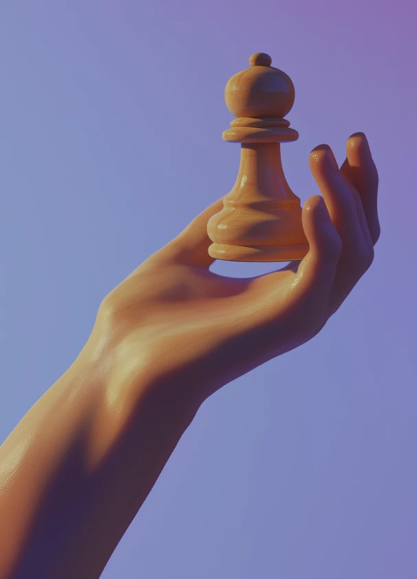 A hand holding a chess piece.